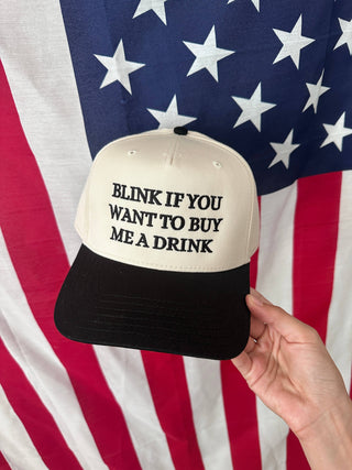 BLINK TO BUY ME A DRINK TRUCKER HAT