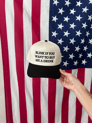 BLINK TO BUY ME A DRINK TRUCKER HAT